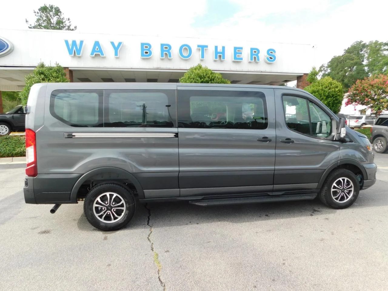 New 2026 Carbonized Gray Metallic Ford Passenger Van XLT image 1