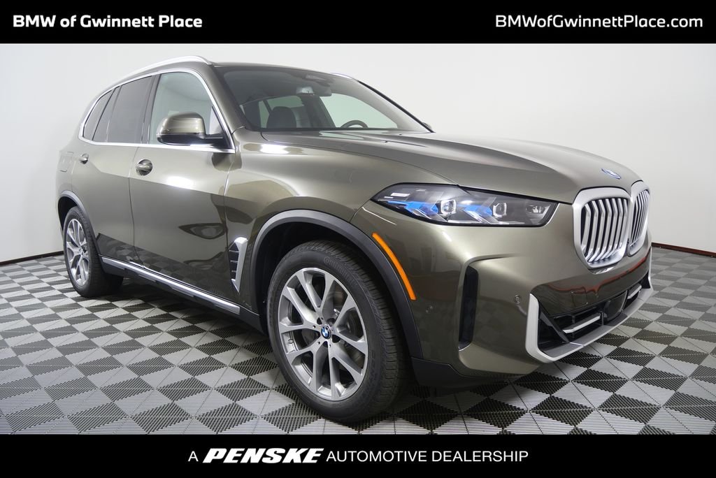 New 2026 Manhattan Green Metallic BMW xDrive50e image 1