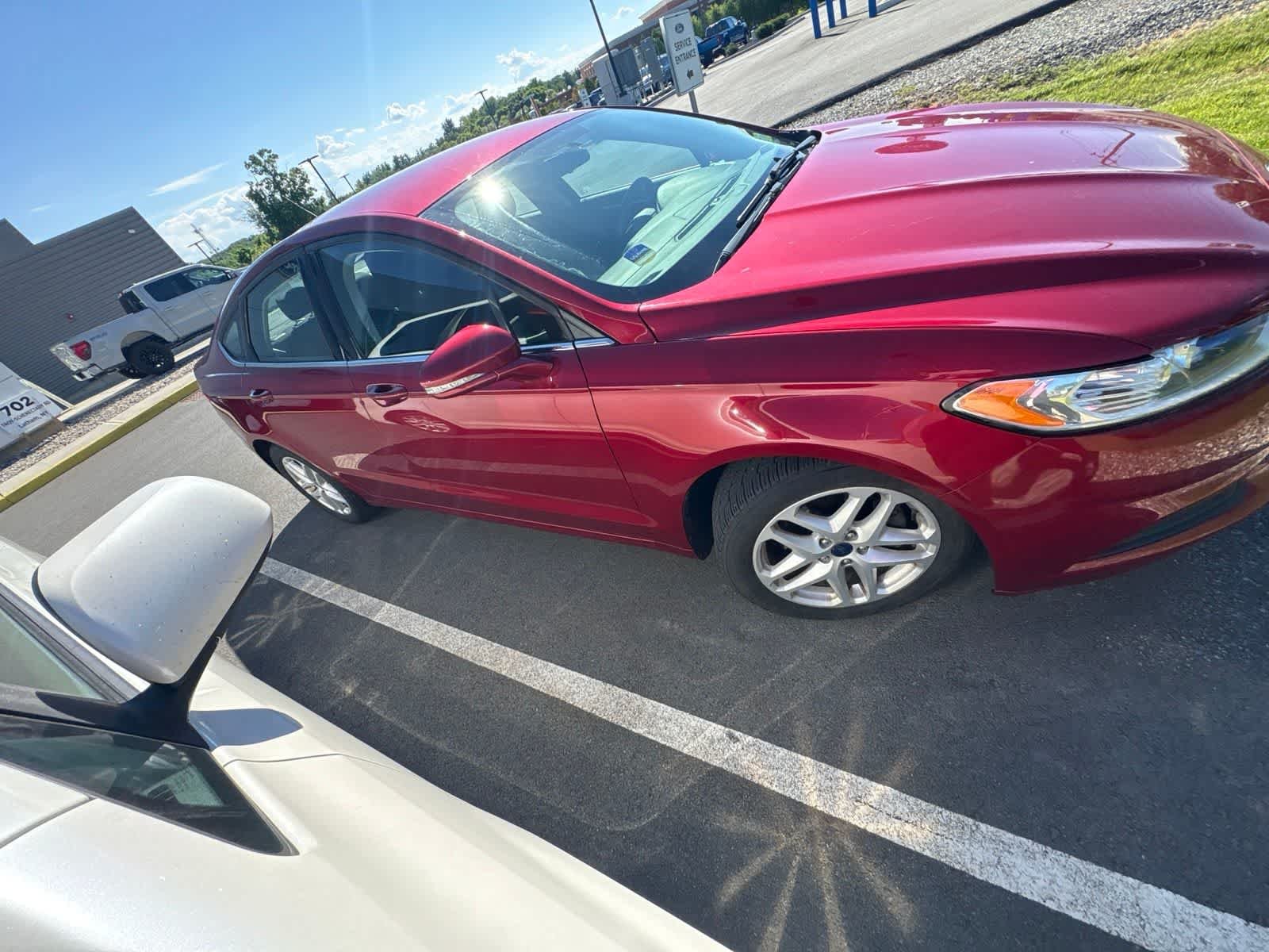 Used 2016 Ruby Red Tinted Clearcoat Ford SE image 2