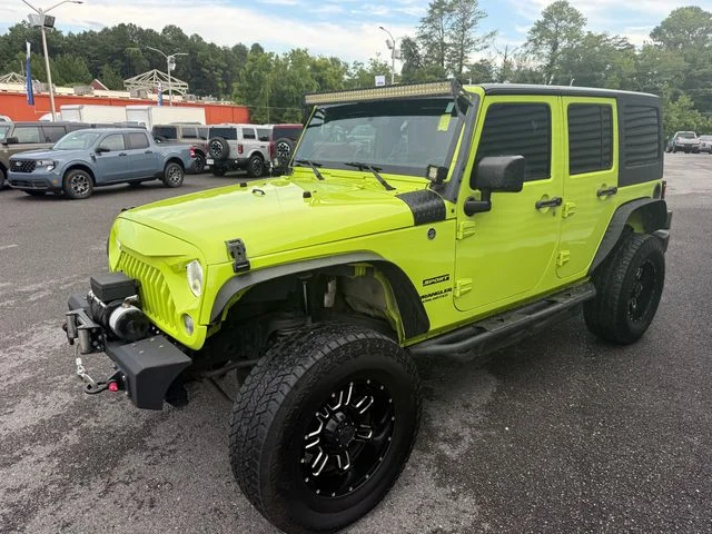 Used 2017 Green Jeep Unlimited Sport image 1
