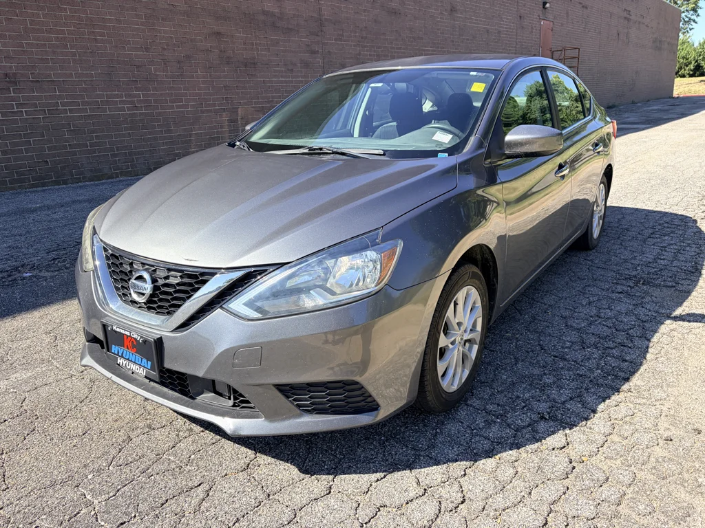 Used 2018 Gun Metallic Nissan SV image 1