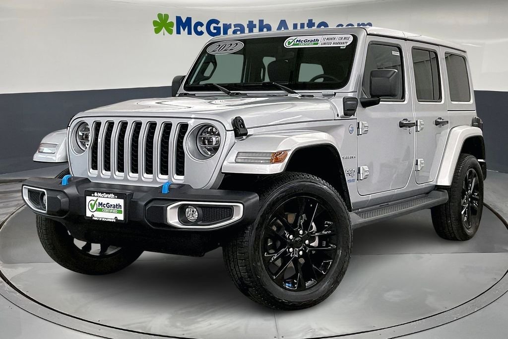 Certified 2022 Jeep Wrangler Unlimited Sahara 4XE with VIN 1C4JJXP68NW228112 for sale in Iowa City, IA