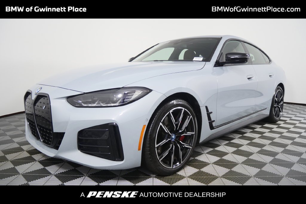 Used 2024 Brooklyn Grey Metallic BMW eDrive40 image 1