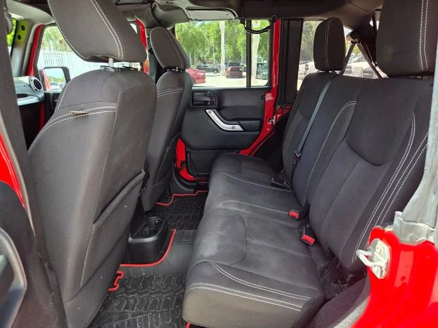 Used 2015 Red Jeep Unlimited Sahara image 14