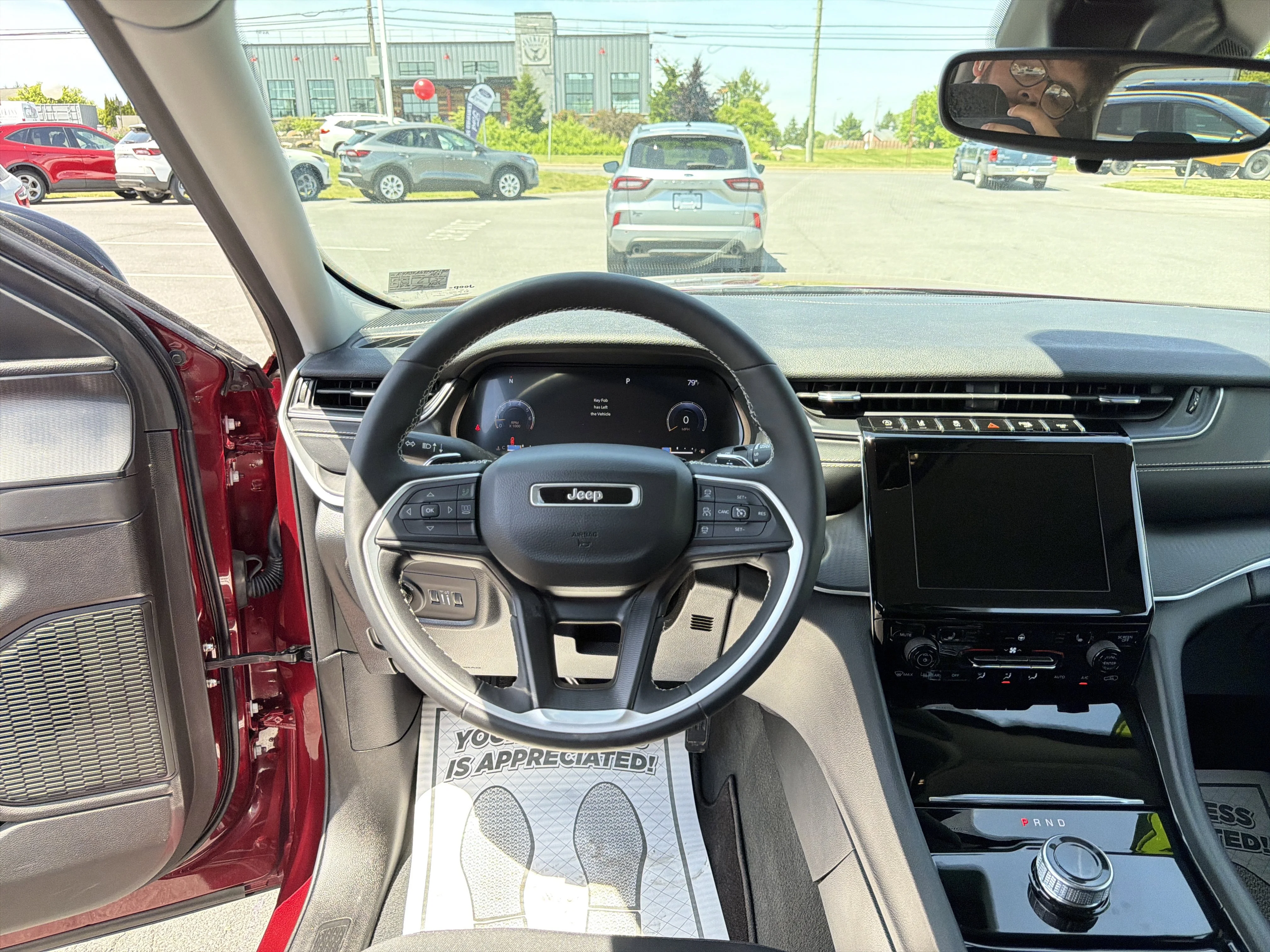 Used 2023 Velvet Red Pearlcoat Jeep Laredo image 18