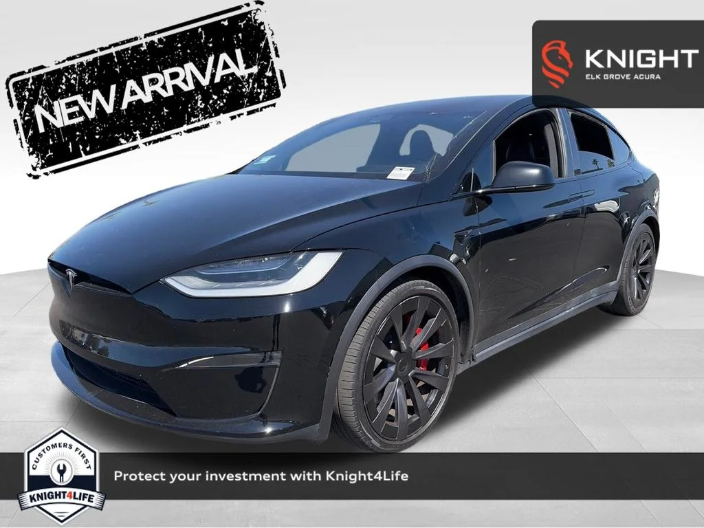 Used 2023 Solid Black Tesla Plaid image 1