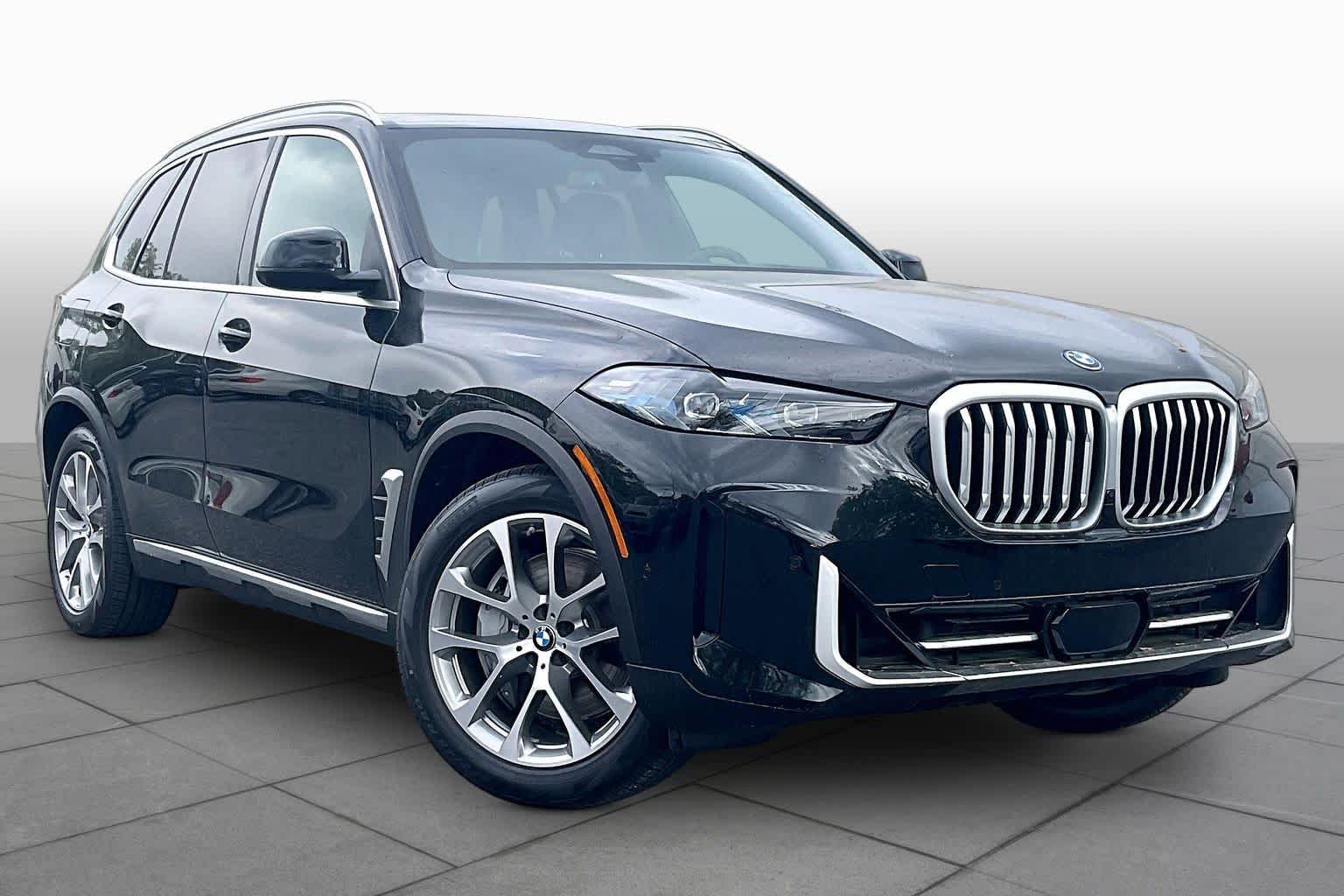 Used 2026 Black Sapphire Metallic BMW xDrive50e image 2