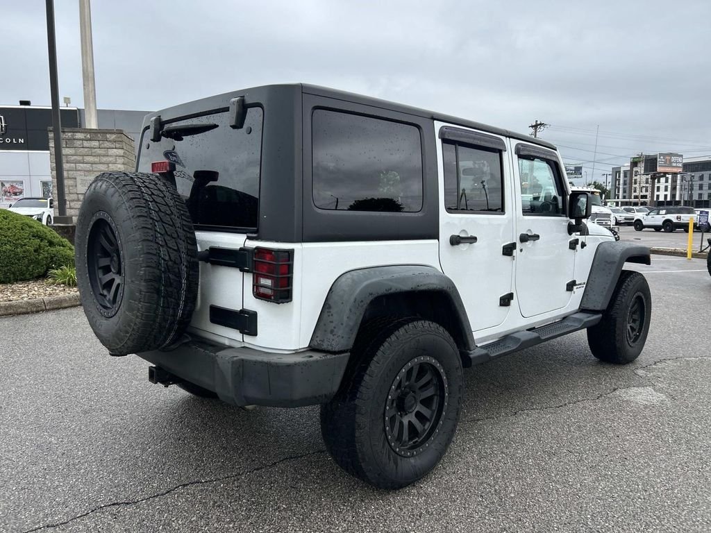 Used 2012 Bright White Jeep Unlimited Sport image 4