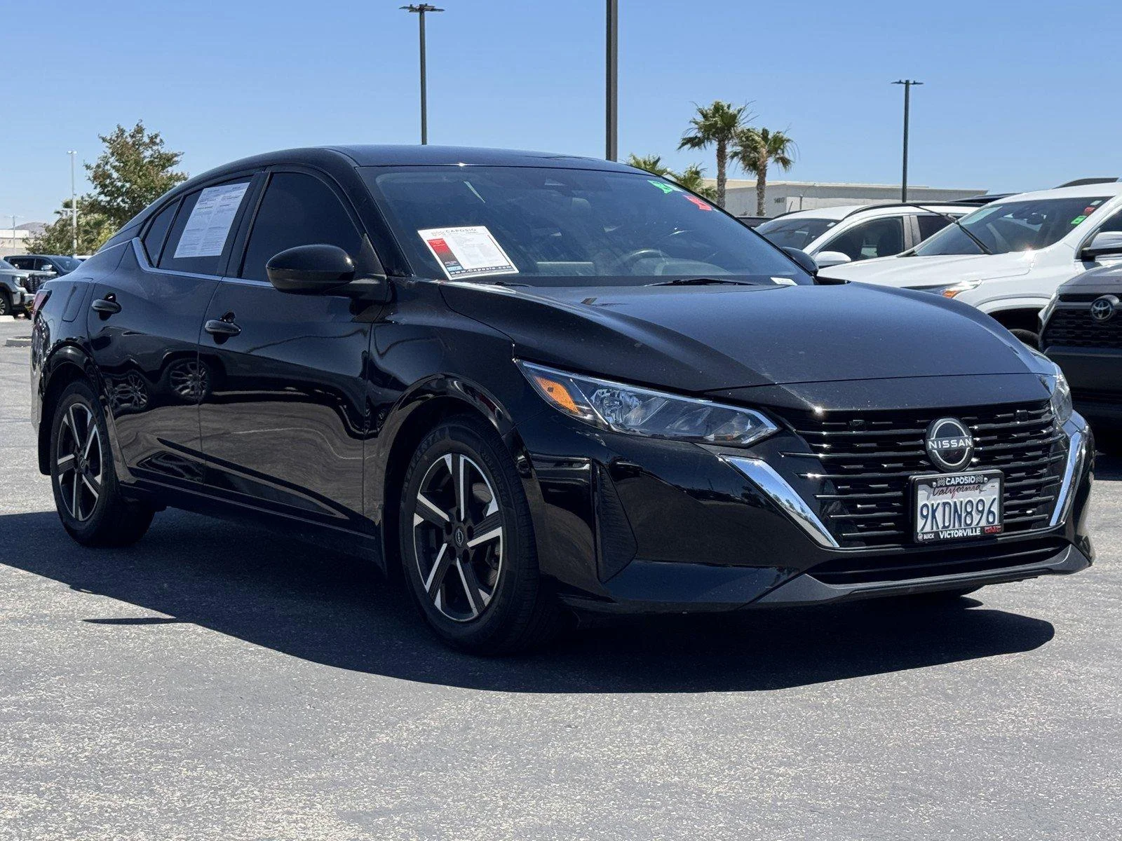 Used 2024 Super Black Nissan SV image 1