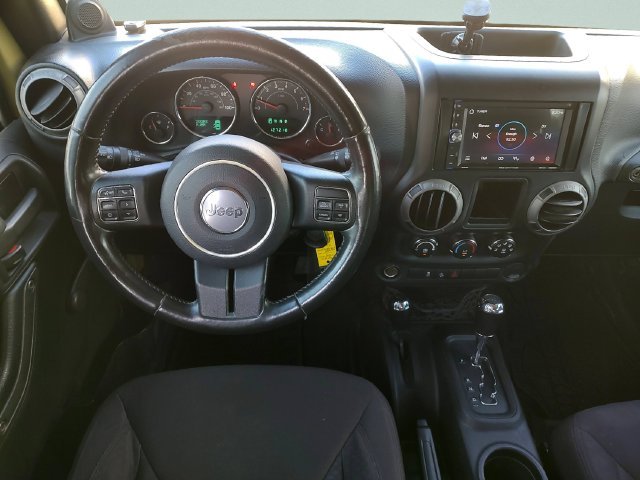 Used 2013 Green Jeep Unlimited Sport image 10