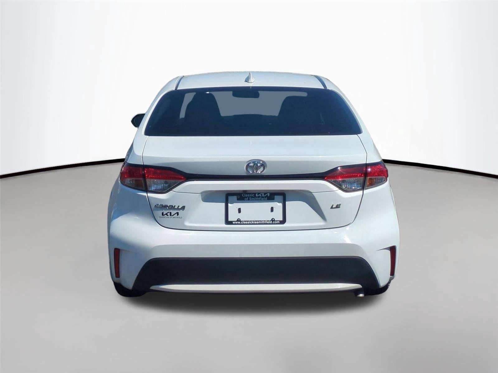 Used 2021 Super White Toyota LE image 4