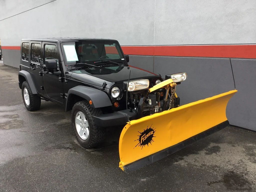 Used 2010 Black Jeep Unlimited Sport image 2