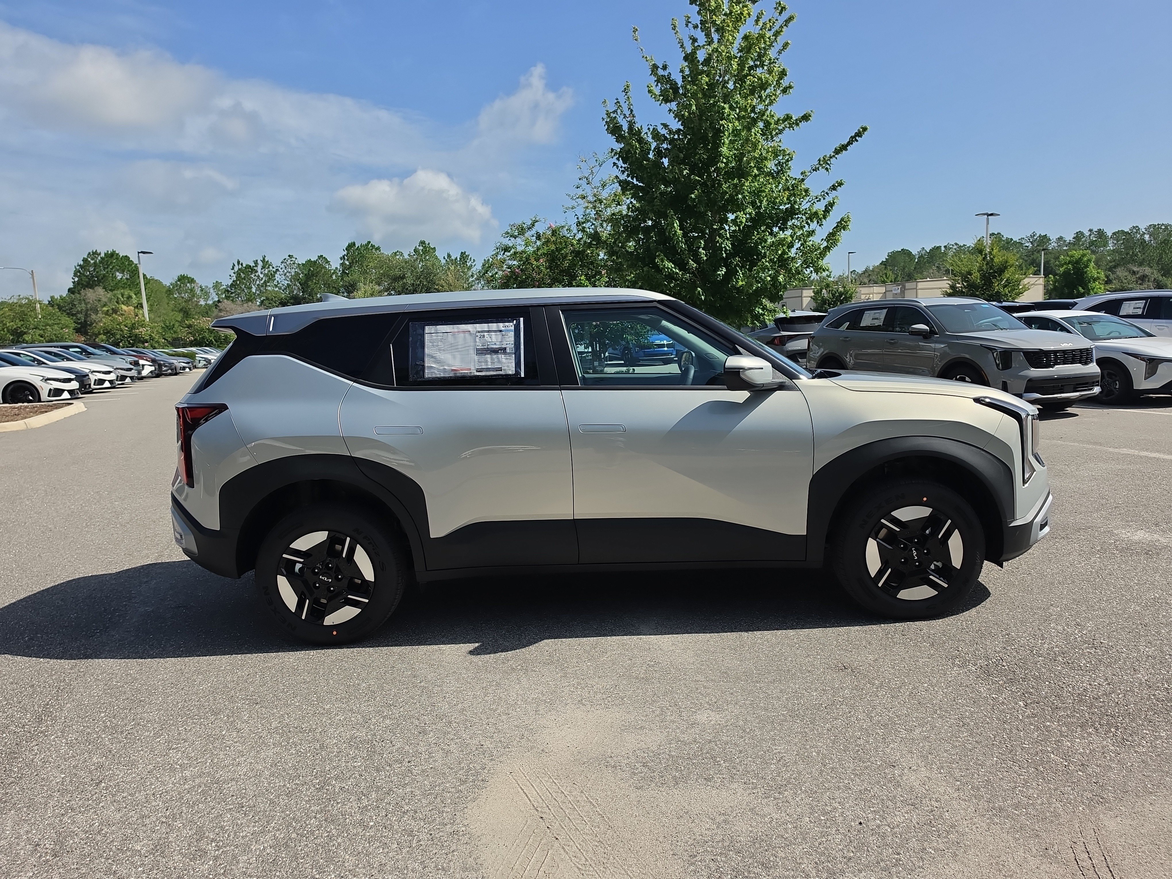 New 2027 Ivory Silver Kia LX image 9