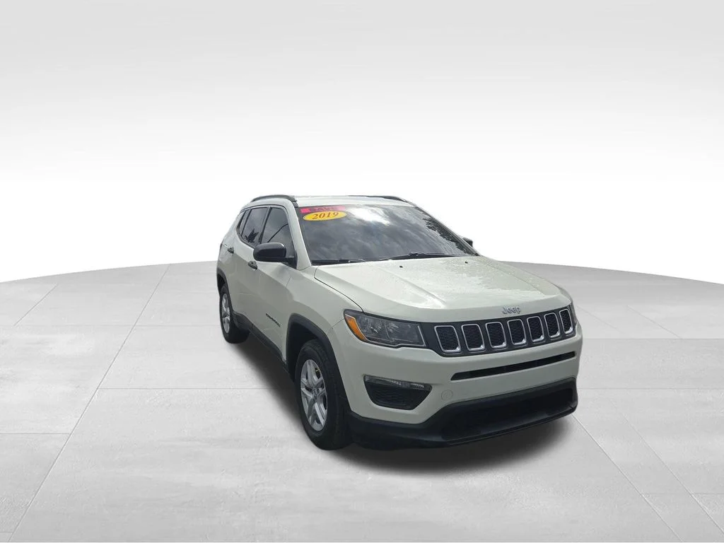 Used 2019 White Clearcoat Jeep Sport image 1