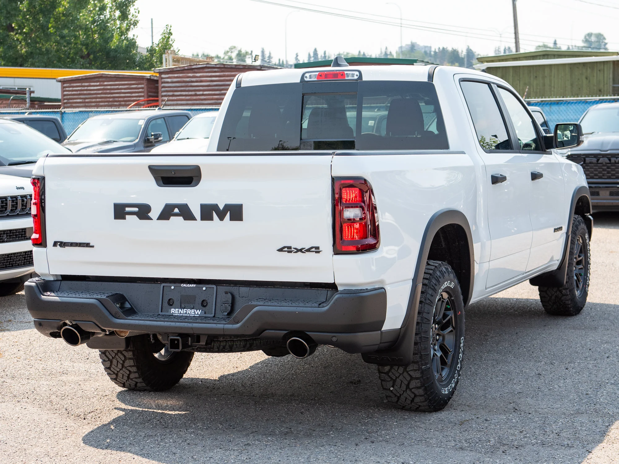 New 2026 White RAM Rebel* Crew Cab 4x4, 33 Inch A/T Tires, Factory Suspension Lift, Bilstein Shocks image 8