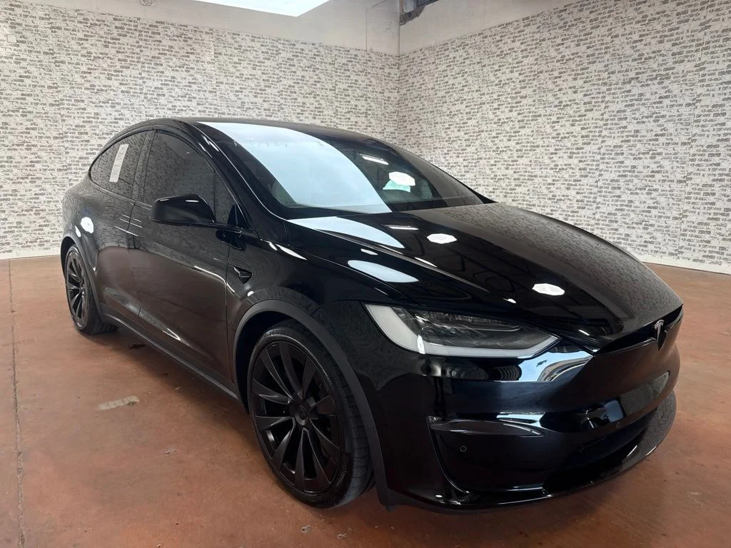 Used 2022 Solid Black Tesla Base image 1