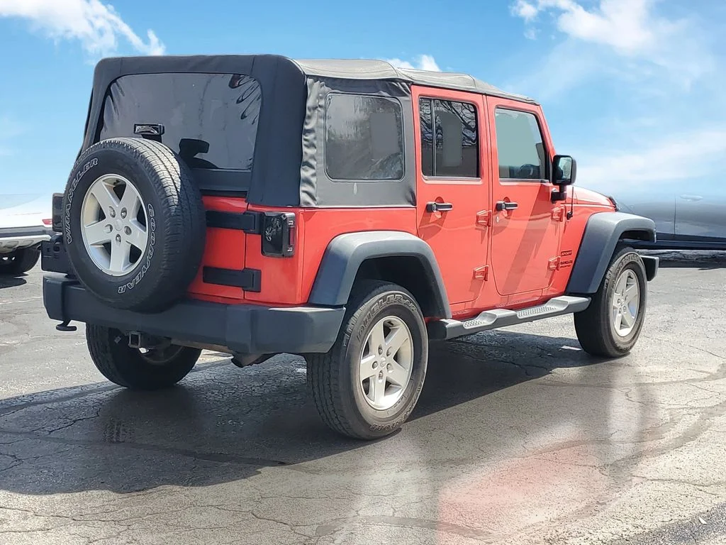 Used 2013 Red Jeep Unlimited Sport image 4
