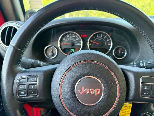Used 2014 Red Jeep Unlimited Sahara image 16