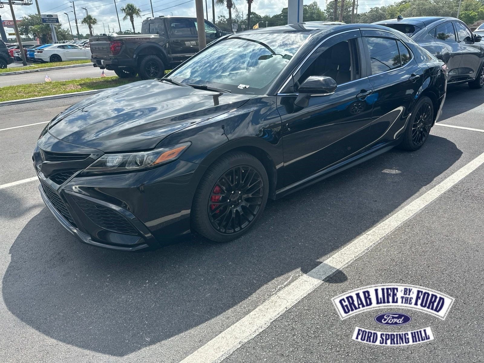 Used 2023 Midnight Black Metallic Toyota SE image 1