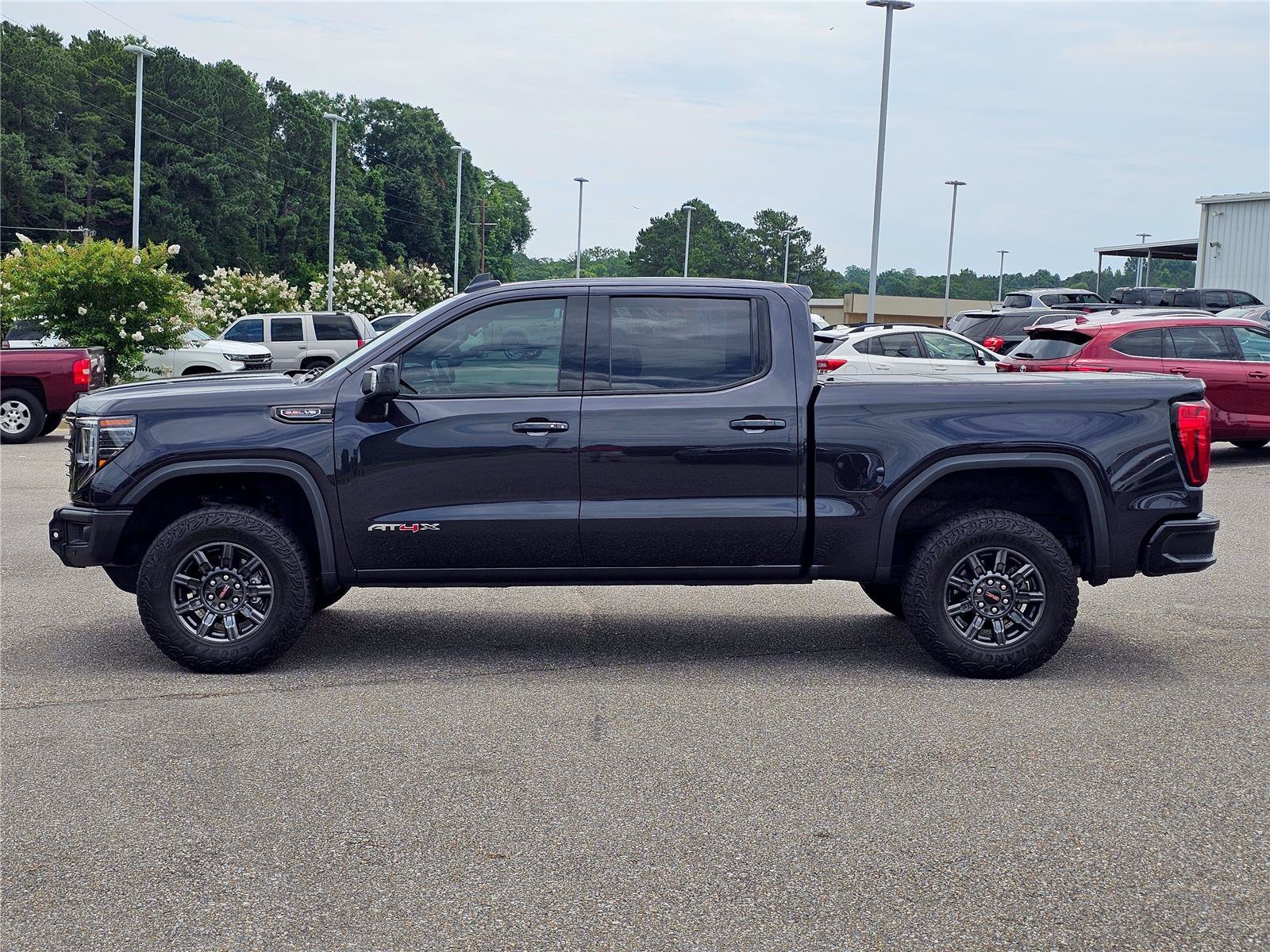 Used 2024 Titanium Rush Metallic GMC AT4X image 15