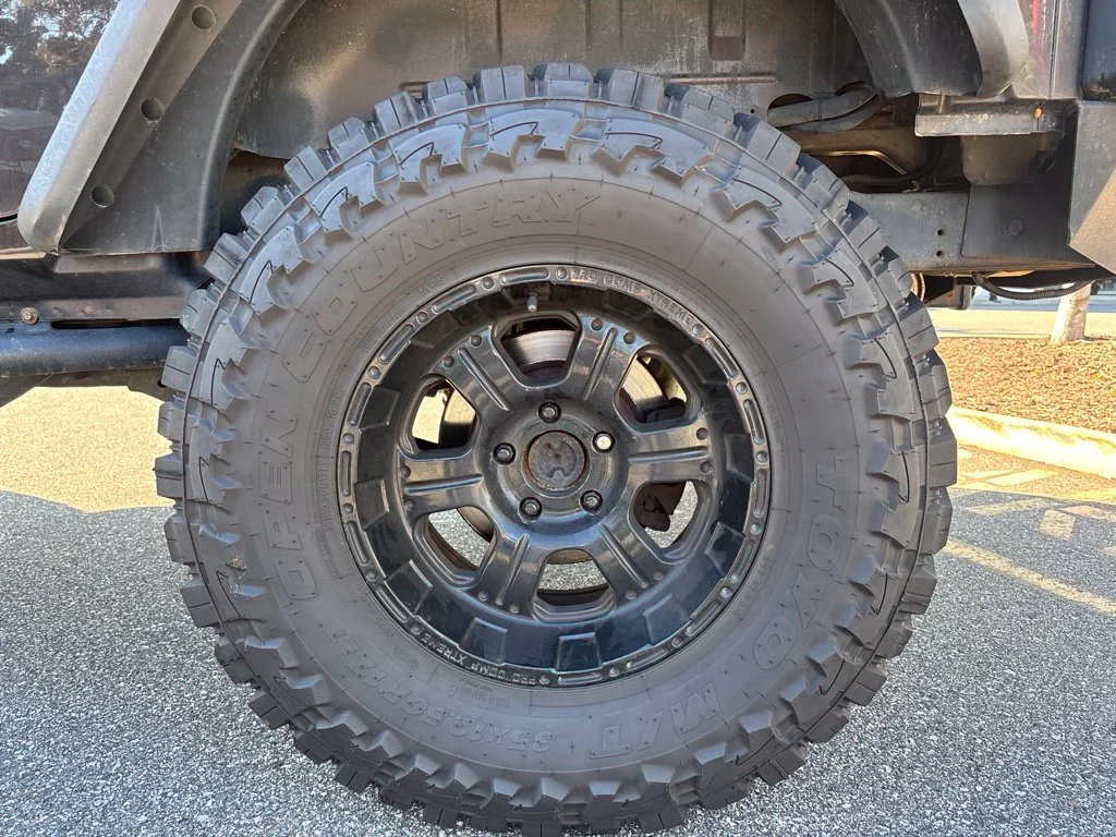 Used 2013 Brown Jeep Unlimited Sport image 14