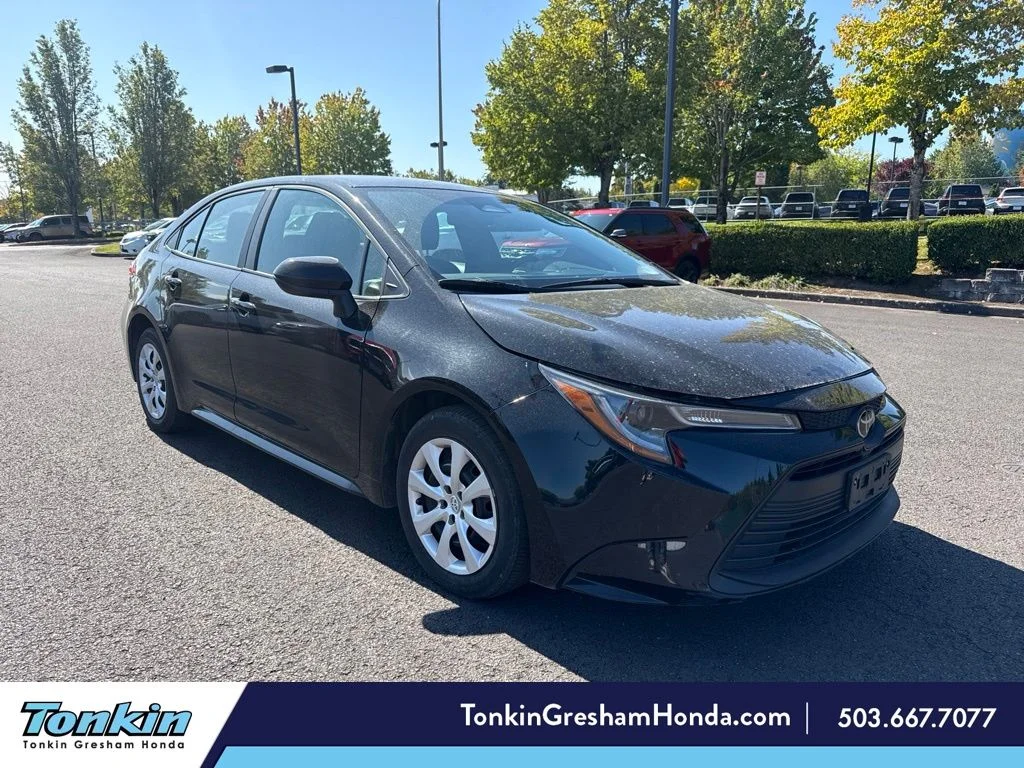 Used 2024 Midnight Black Metallic Toyota LE image 1