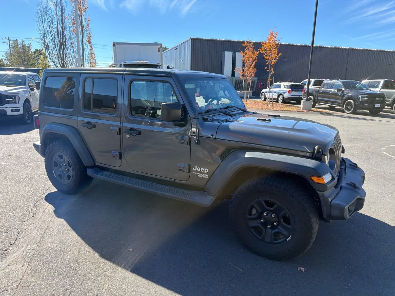 Used 2018 Granite Crystal Metallic Clearcoat Jeep Sport image 4