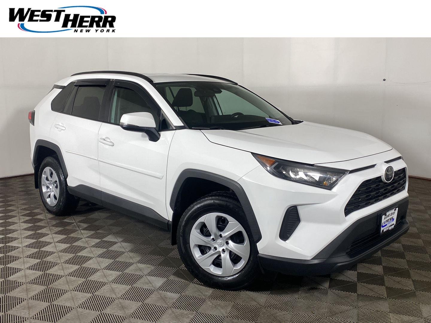 Used 2020 Super White Toyota LE image 1