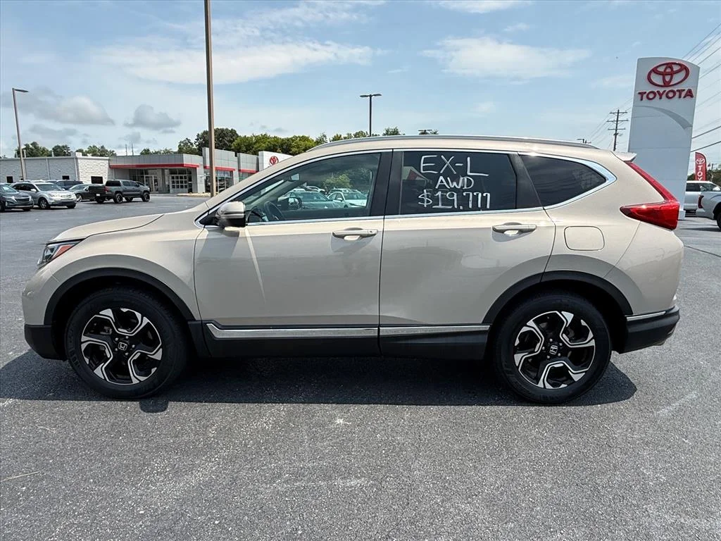 Used 2017 Gold Honda Touring image 1