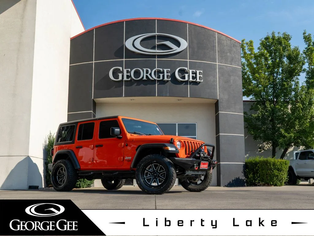 Used 2018 Orange Jeep Unlimited Sport S image 1