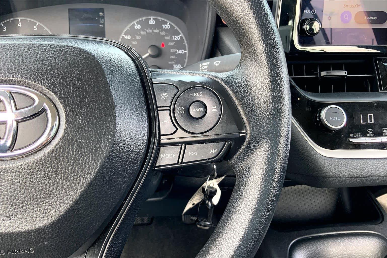 Used 2024 Midnight Black Metallic Toyota LE image 24