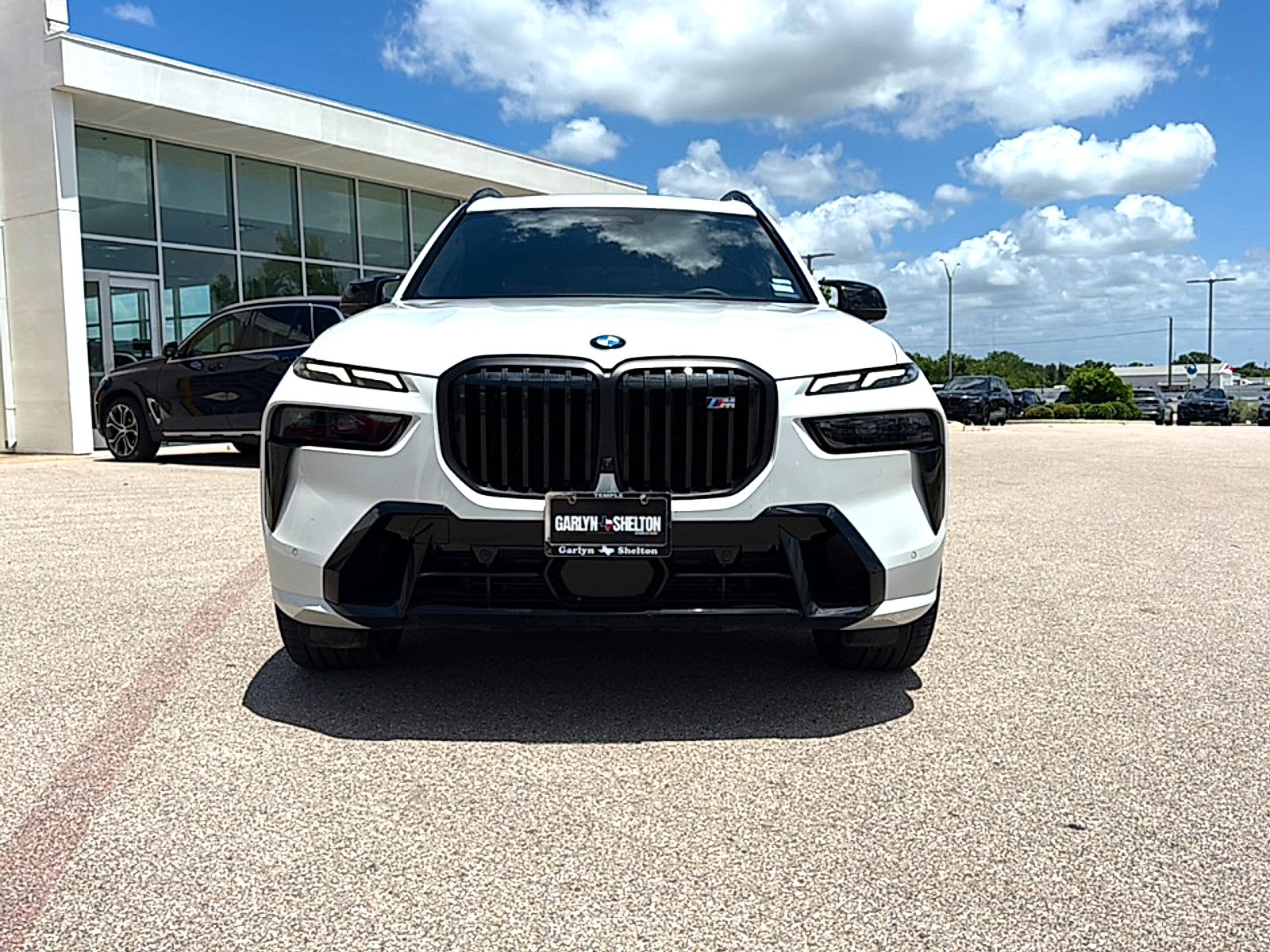 Used 2025 Mineral White Metallic BMW M60i image 2