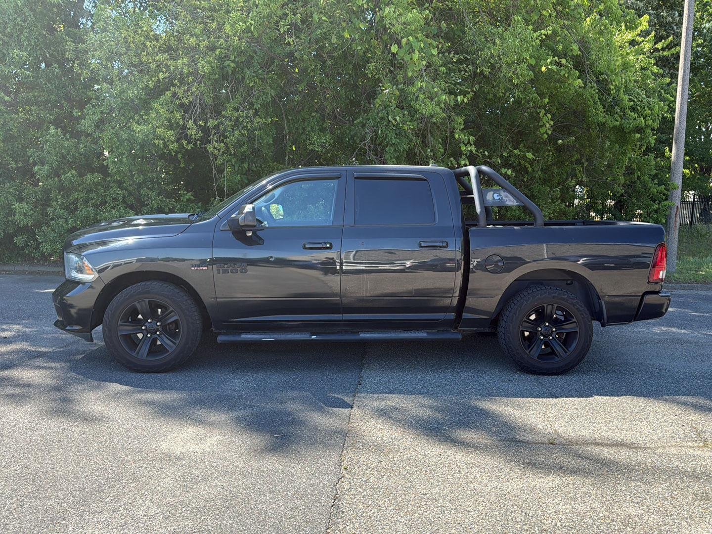 Used 2015 Brilliant Black Crystal Pearl Ram Sport image 8