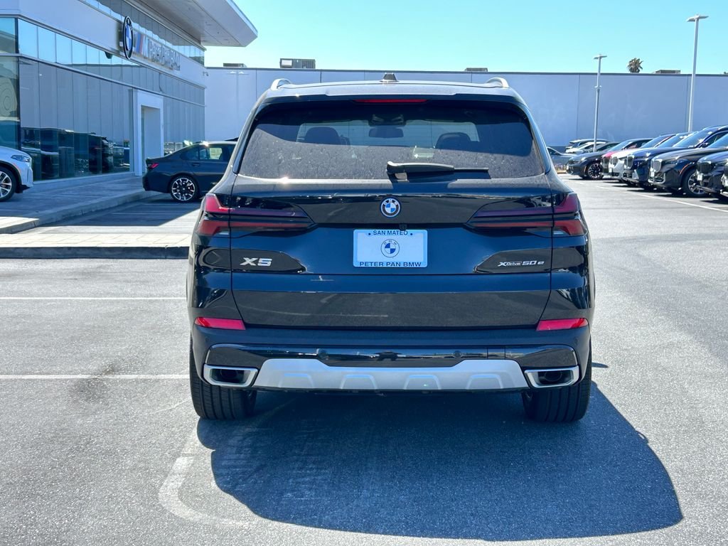 New 2026 Black Sapphire Metallic BMW xDrive50e image 4