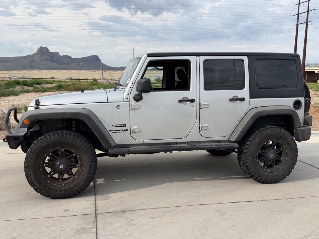 Used 2012 Silver Jeep Unlimited Sport S image 12