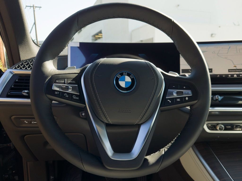 New 2026 Black Sapphire Metallic BMW xDrive50e image 11