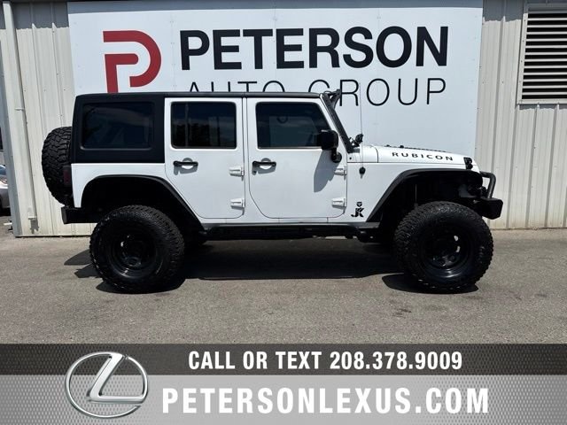 Used 2013 White Jeep Unlimited Sport image 3