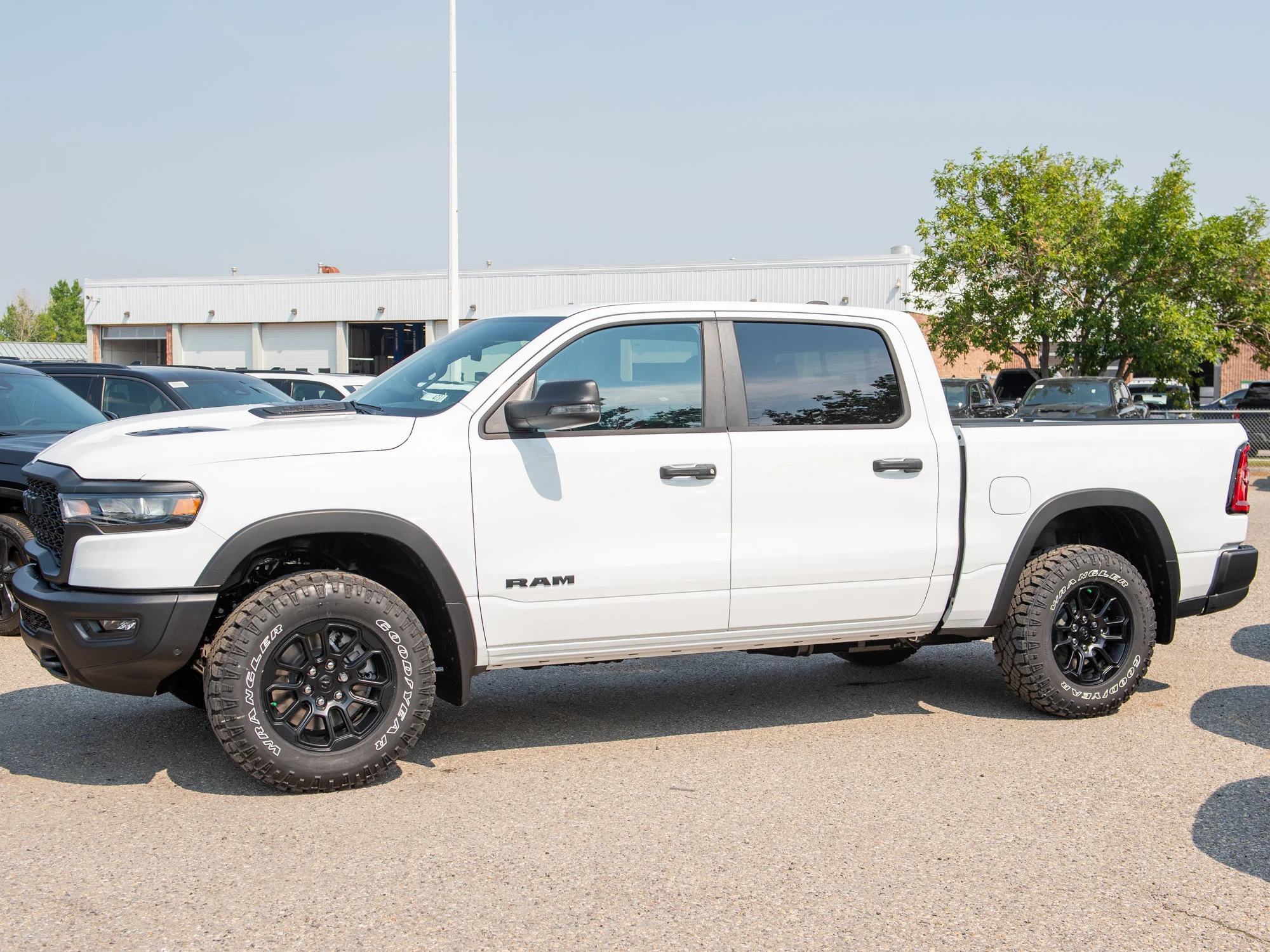 New 2026 White RAM Rebel* Crew Cab 4x4, 33 Inch A/T Tires, Factory Suspension Lift, Bilstein Shocks image 4