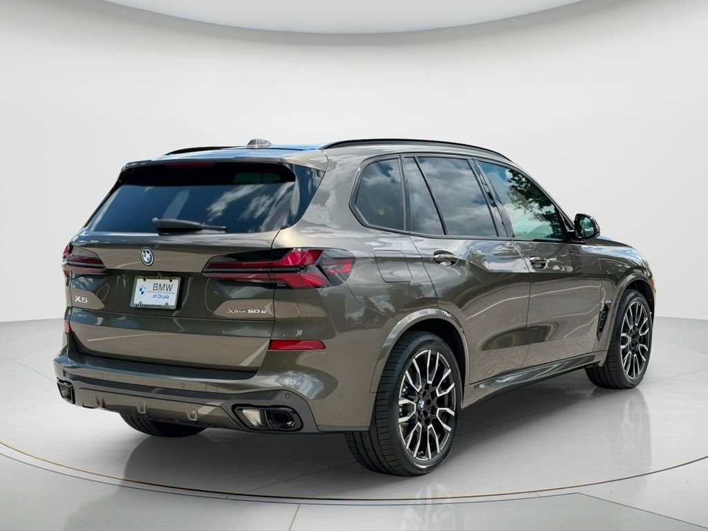 New 2026 Manhattan Green Metallic BMW xDrive50e image 6