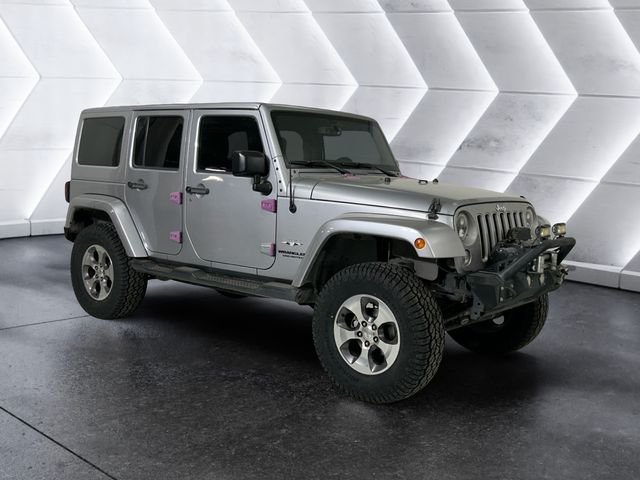 Used 2016 Silver Jeep Unlimited Sahara image 1