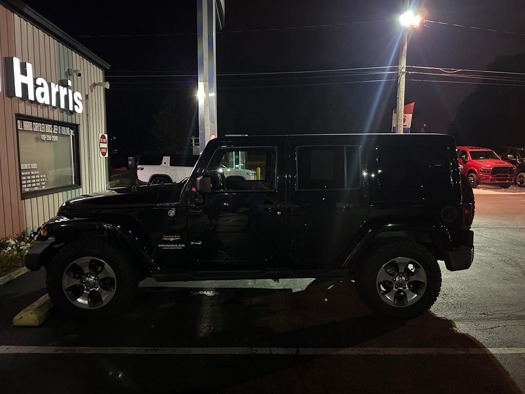 Used 2012 Black Jeep Unlimited Sahara image 2