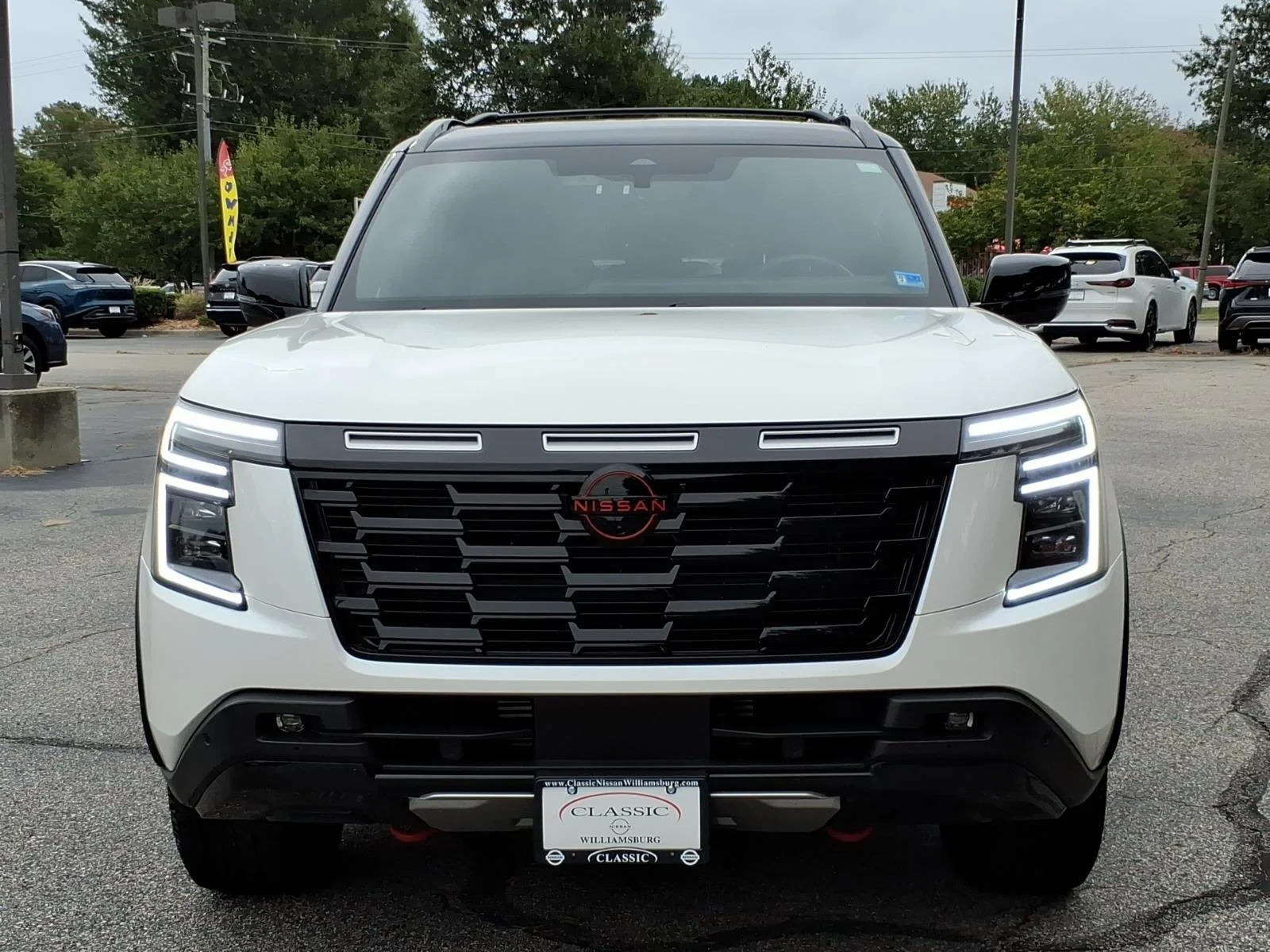 Used 2025 Aspen White Tricoat/Super Black Nissan PRO-4X image 2