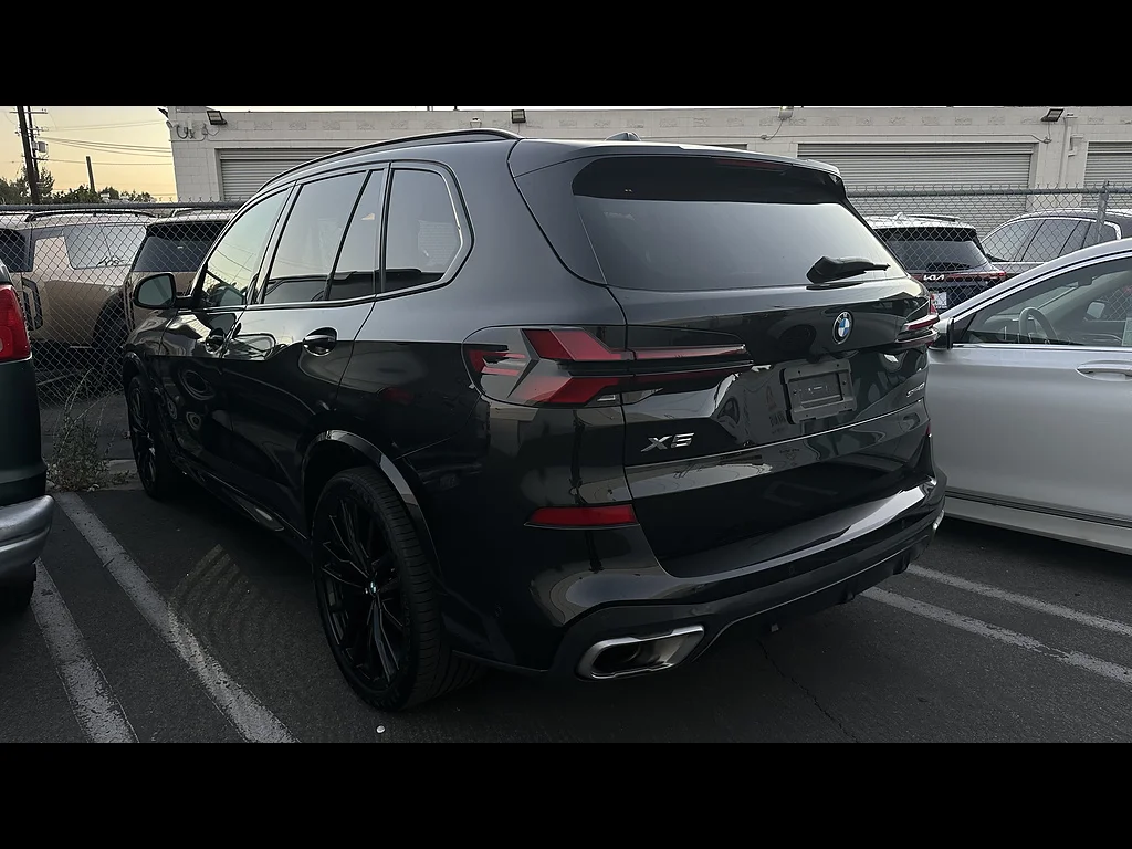 Used 2024 Black Sapphire Metallic BMW sDrive40i image 2