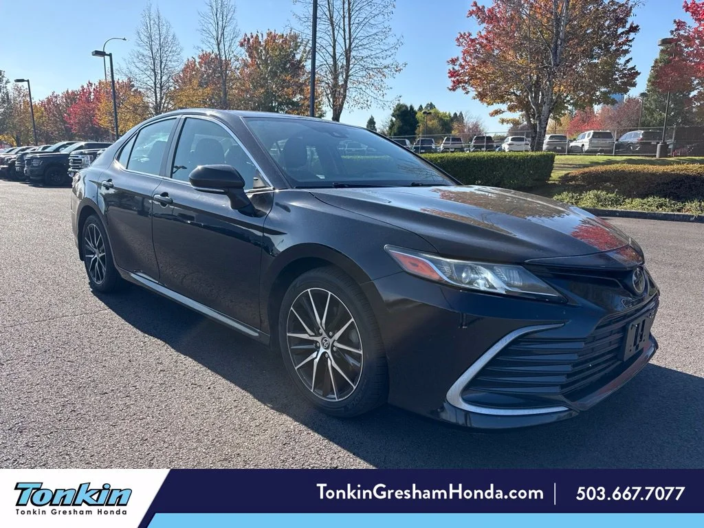 Used 2021 Midnight Black Metallic Toyota LE image 1