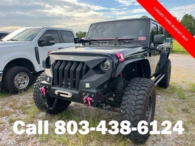 Used 2013 Black Clearcoat Jeep Unlimited Sport image 2