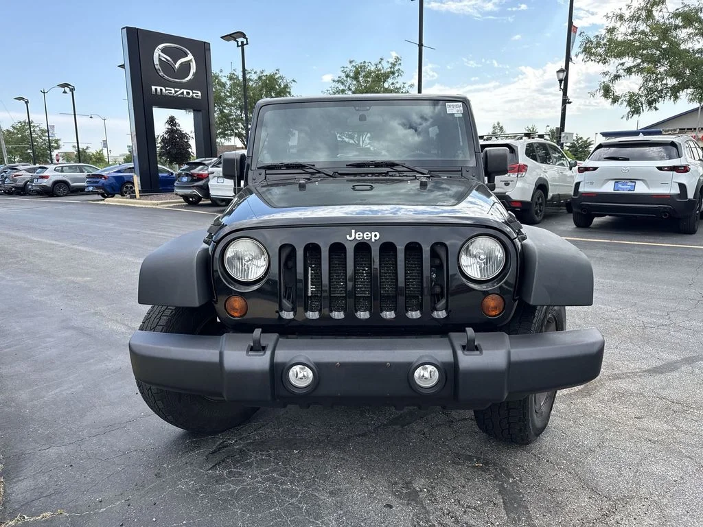 Used 2013 Black Jeep Unlimited Sport image 6