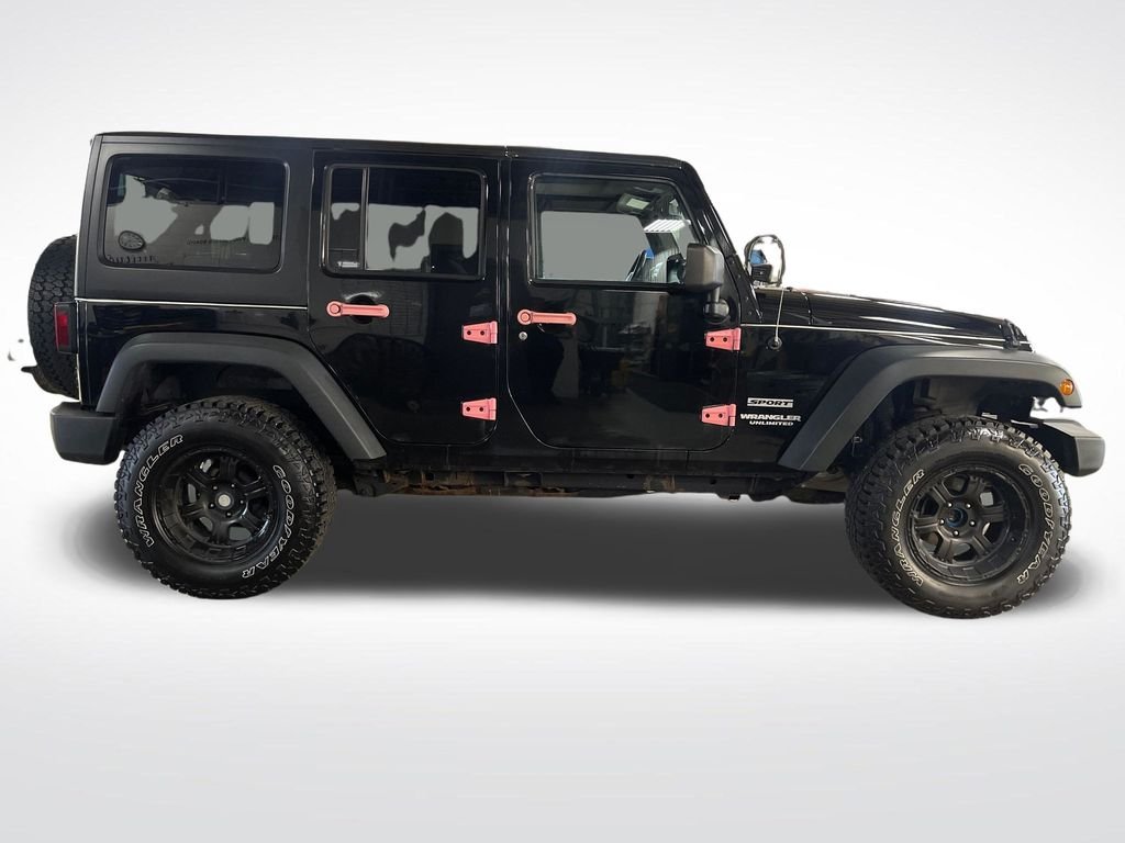 Used 2013 Black Jeep Unlimited Sport image 7