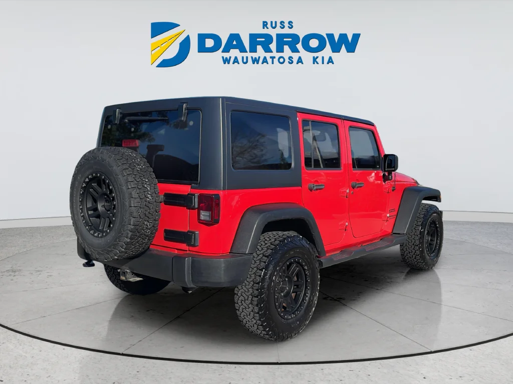 Used 2013 Red Jeep Unlimited Sport image 5