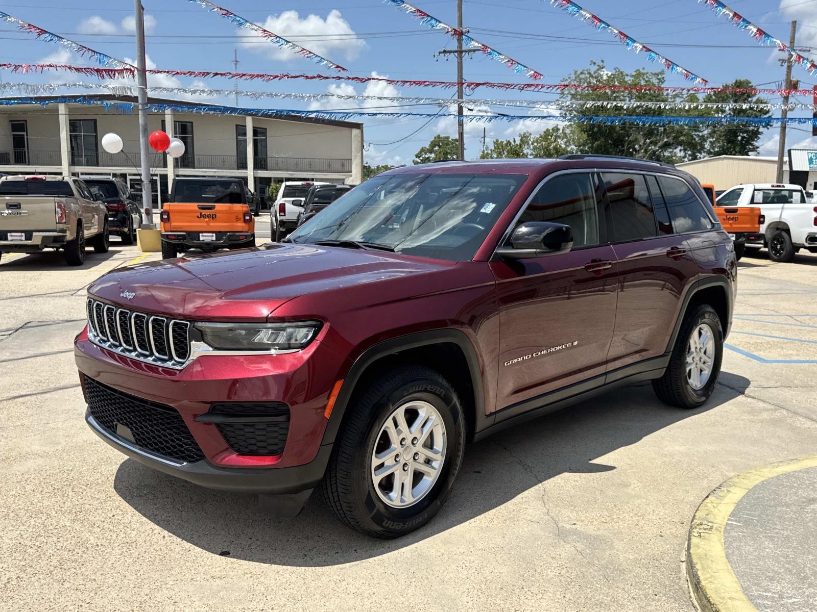 Used 2024 Velvet Red Pearlcoat Jeep Laredo image 3