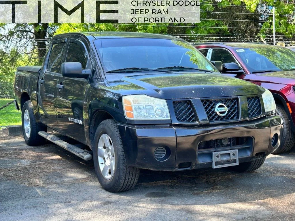Used 2006 Black Nissan XE image 1
